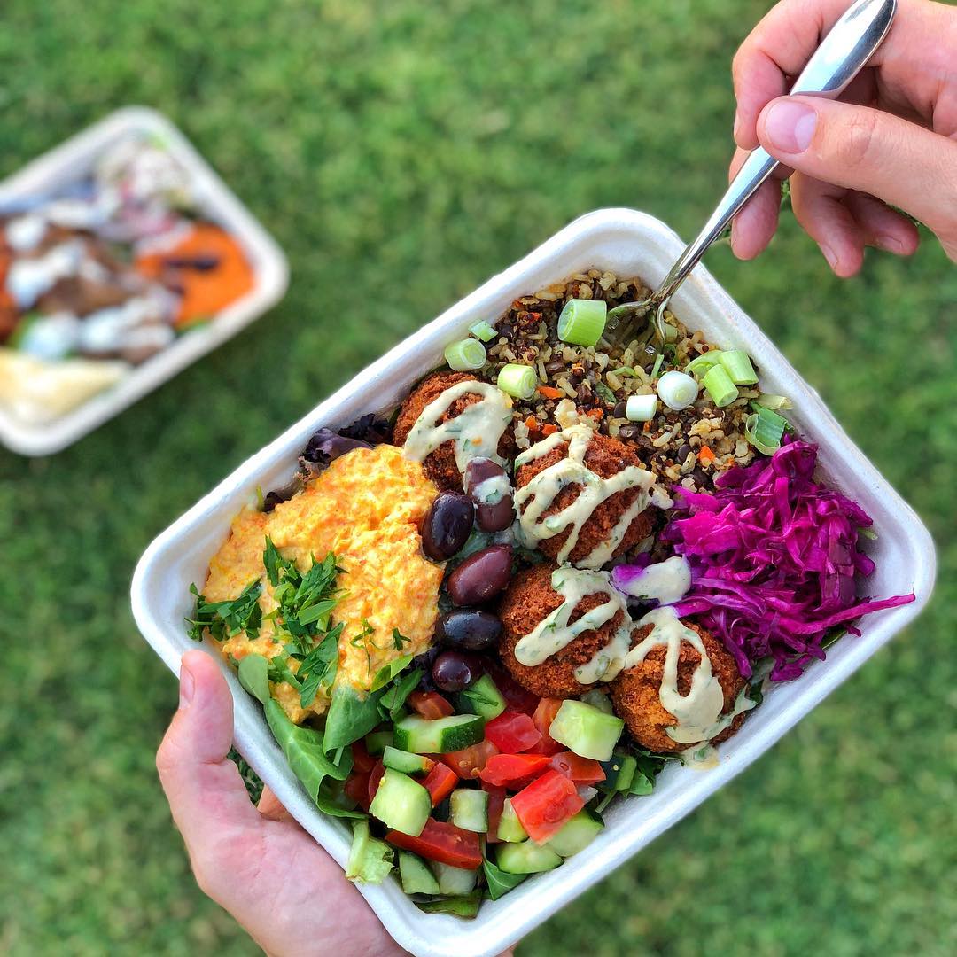 A freshly prepared MezzeMe meal served in a takeaway tray